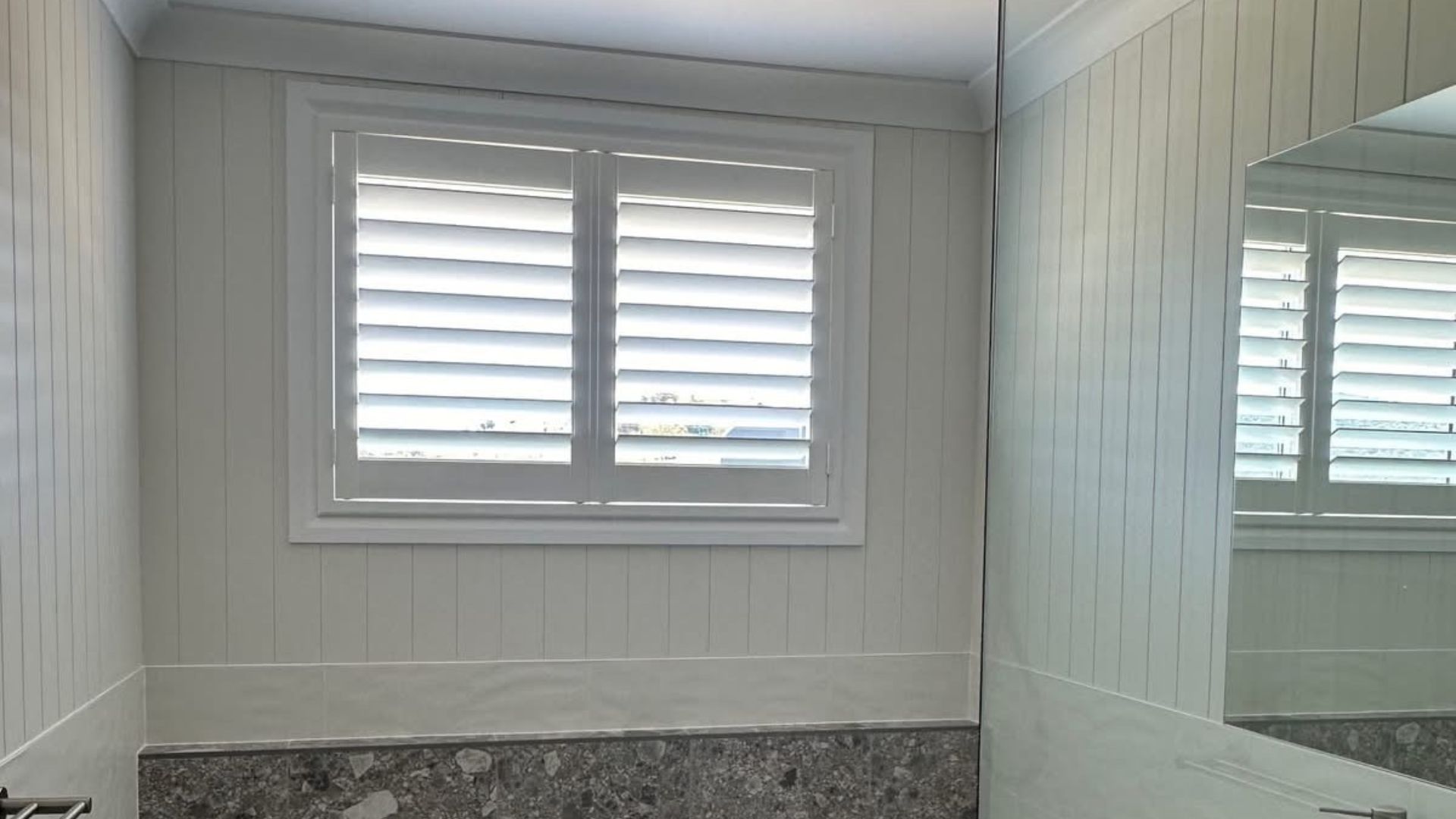 White Bathroom Shutters with Stone Finishes